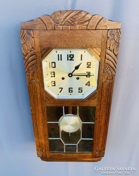 Carved wood oven wall clock.