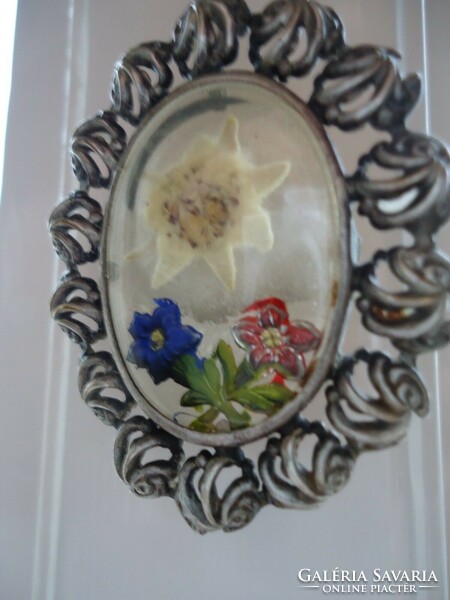 Antique German filigree silver pendant with a pair of snowdrops and enameled flower decorations under glass