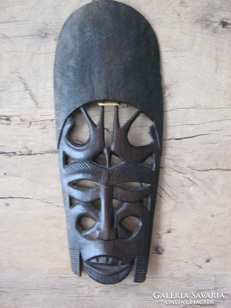 Wooden mask with exotic wall ornament