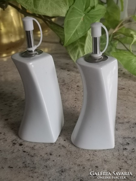 Shaped porcelain holding oil and vinegar, in a pair 17 cm
