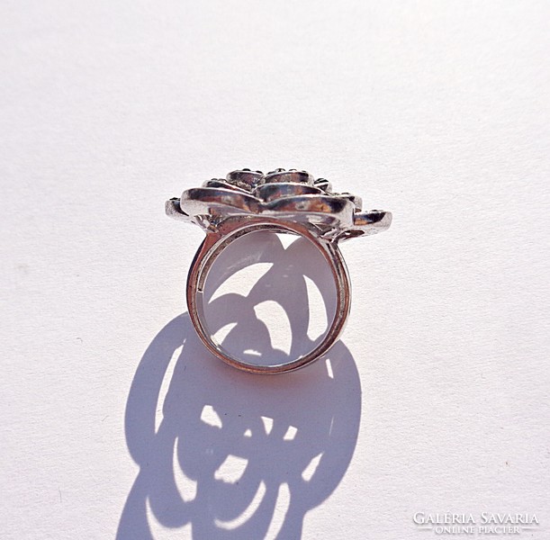 Silver ring with many stones and flower pattern