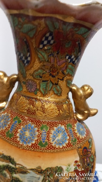 Old xx.No. Porcelain vase made from the second half, depicting an oriental scene, gilded decoration