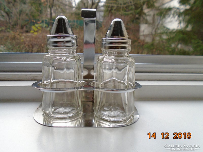 2 octagonal glass spice dispensers in a chromed metal holder
