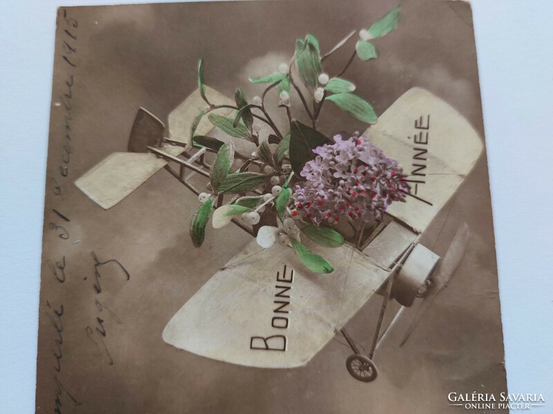 Régi újévi képeslap 1915 levelezőlap repülő virágok