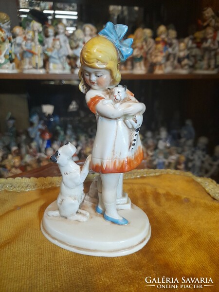 German, Germany Grafenthal, hand-painted porcelain figurine of a little girl petting a dog and cat. 15 Cm.