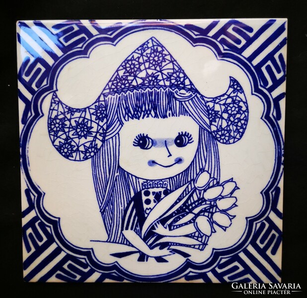 Dutch tile with a little girl pattern