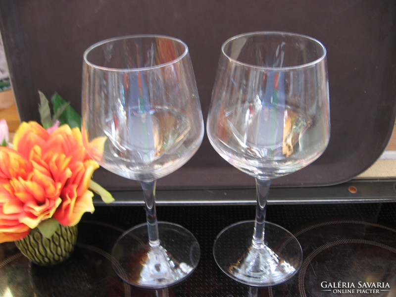 2 large, elegant stemmed champagne glasses for wedding occasions.