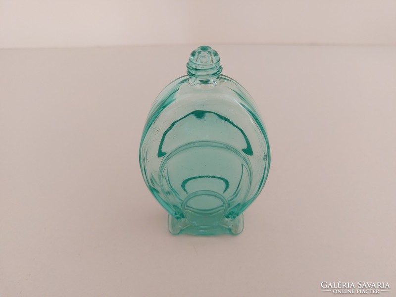 Old art deco perfume bottle in turquoise vintage cologne bottle