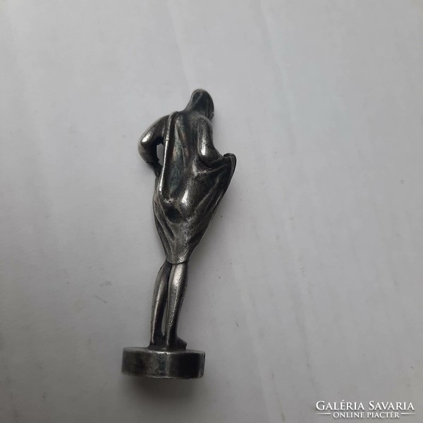 Discreet erotic metal figurine
