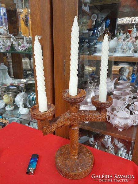 Hand-carved wooden 3-branch candle holder with a folk motif. 27 cm.