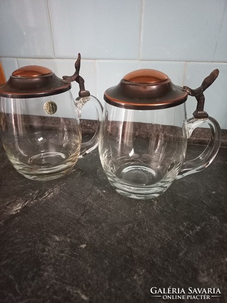 2 hand-blown beer mugs with a copper lid