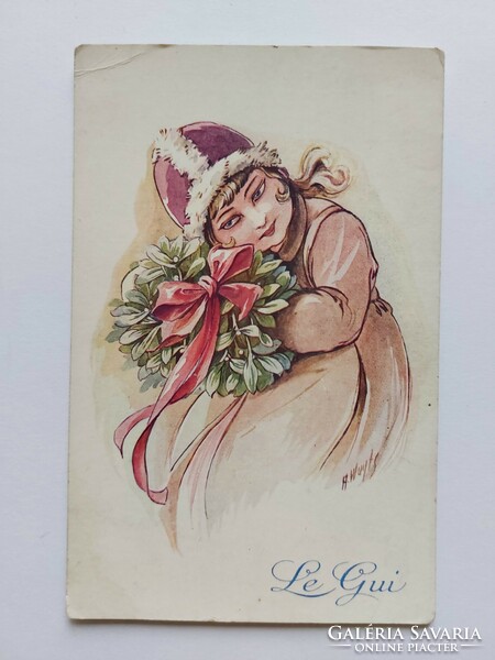 Old Christmas postcard with a picture postcard of a little girl mistletoe
