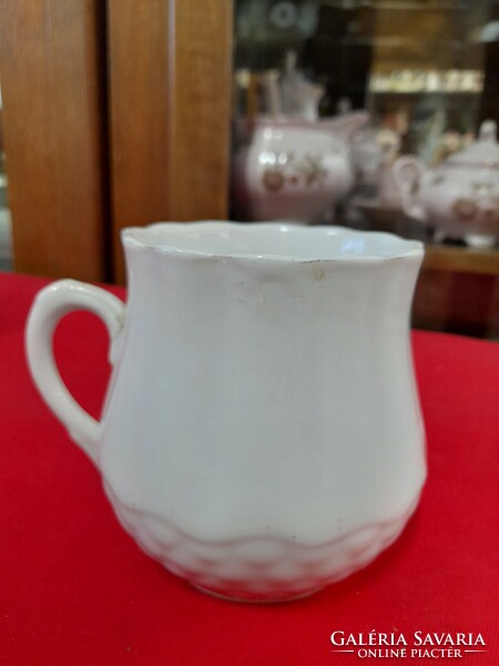 Old porcelain mug with flower pattern. Marked.