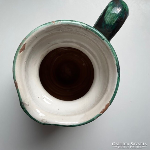 Old white hand-painted ceramic mug, jug