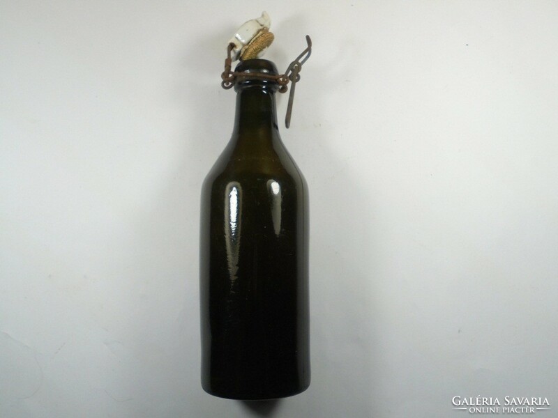 Old antique dark green glass bottle with buckle - 23 cm high, approx. 0.5 l approx. From the 1920s