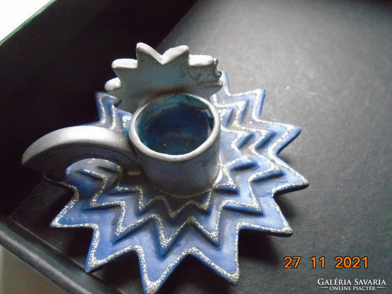 Christmas candle holder with a blue star base and a silver-plated sunburst face
