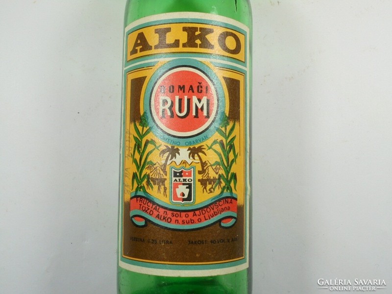 Retro glass bottle with old paper label - alcoholic rum - Yugoslav-Serbian drink - 1980s 0.25 l