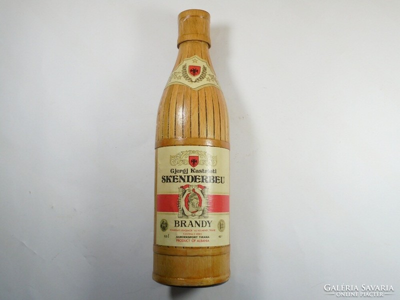 Retro old paper label wood covered glass bottle - Skenderbeu brandy Albania drink - 1980s 0.5 l