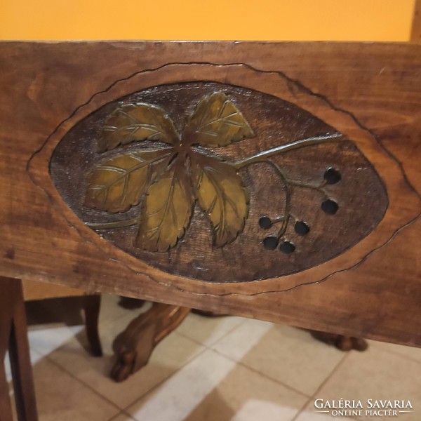 Wooden flower stand with a carved grape leaf pattern