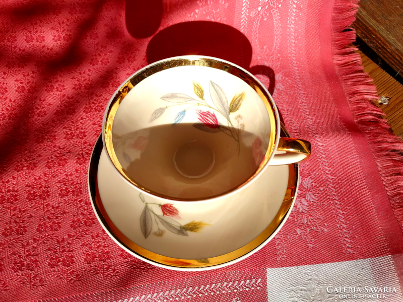 Graceful porcelain coffee cup with saucer