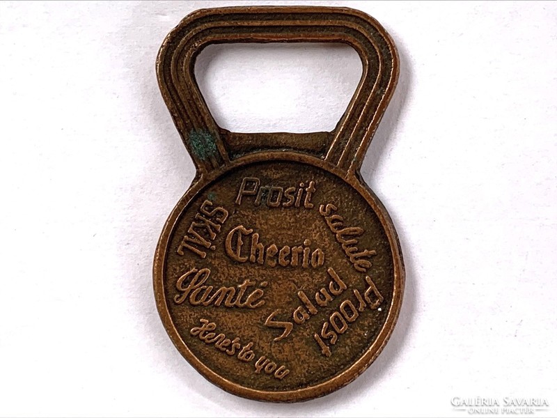 Copper beer opener, written in several languages: for your health