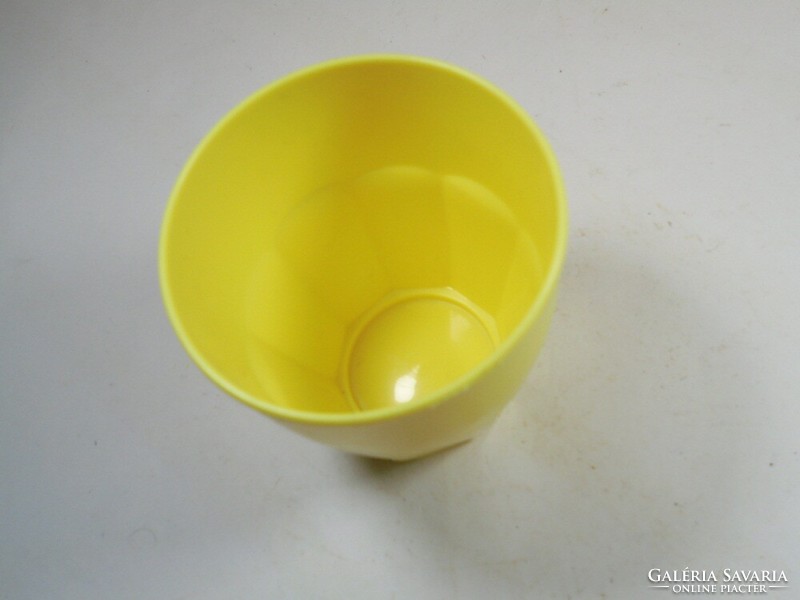 Retro old yellow plastic toothbrush cup from the 1970s