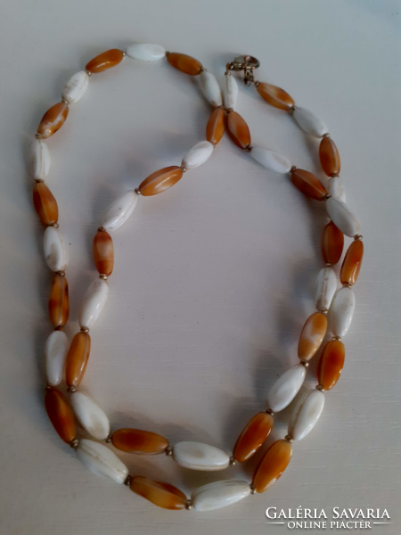Old porcelain necklace in good condition with safety switch