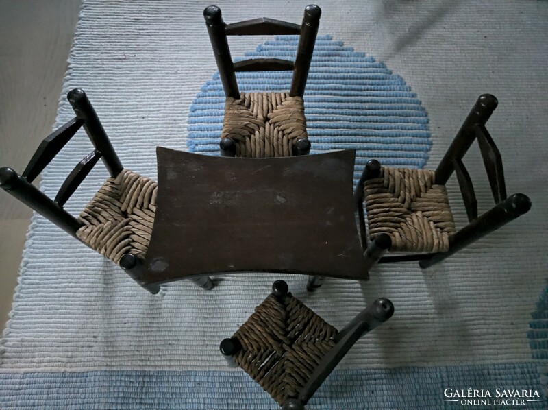 Dollhouse wicker chairs with a square table