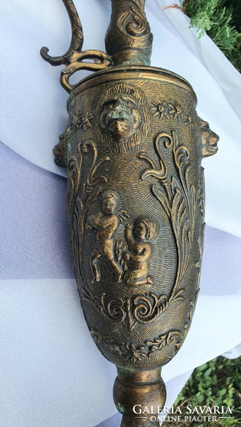 Metal carafe, pitcher with mythological decoration