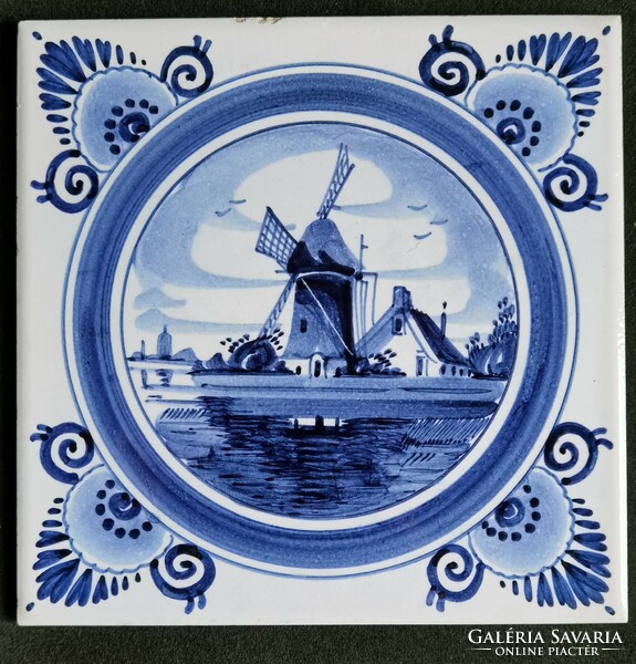 Old hand painted blue white delft tile landscape with windmill