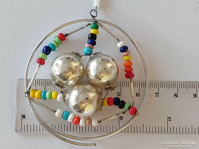 Old glass Christmas tree ornament colorful glass ornament in the shape of a snow crystal with pearls
