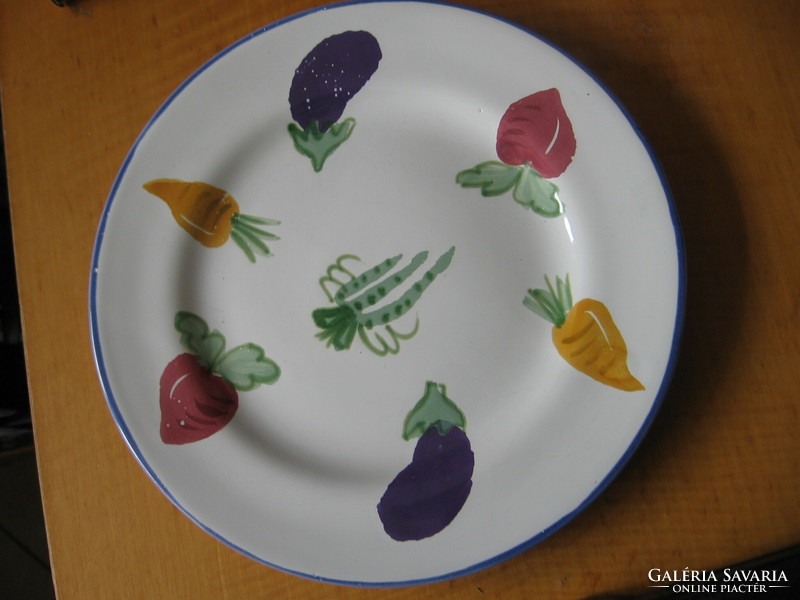 Signed ceramic plate with a vegetable pattern