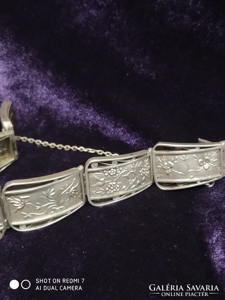 Silver (900) women's bracelet composed of Vietnamese relief elements.