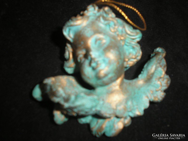 Gilded putto ornament on antique Christmas tree door