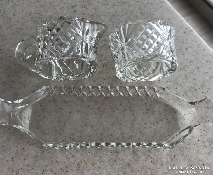 Old carved crystal milk and sugar bowls with tray as part of the elegant table setting