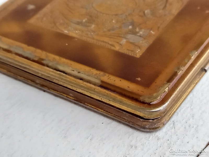 Old, brass-coated powder box with frosted mirror insert