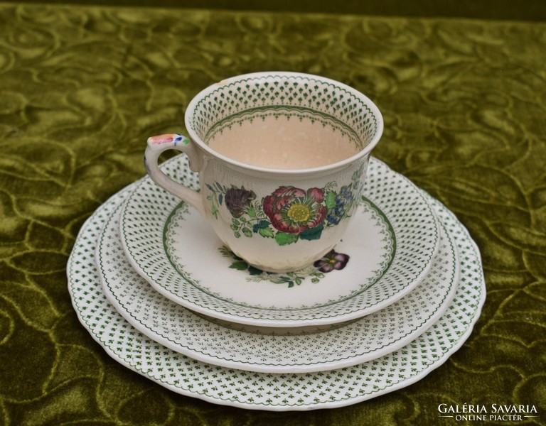 Old manson's cup with plates of English faience breakfast set for a person slightly damaged