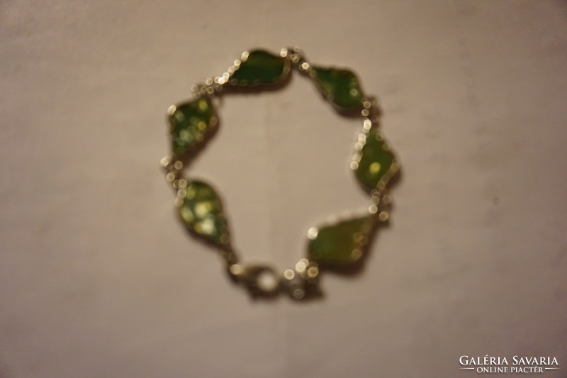 A necklace made of leaf-shaped polished shells with a metal socket for sale for a little girl.