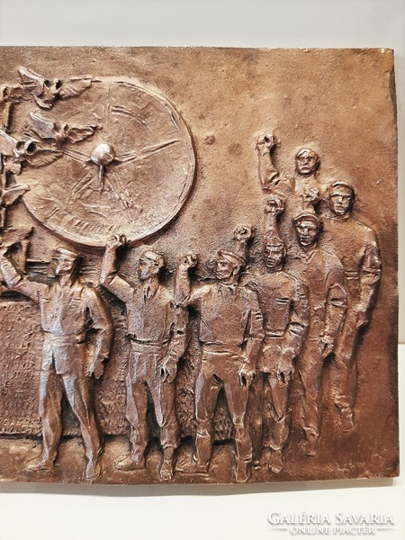 A richly detailed multi-inhabited social realist labor movement bronze relief
