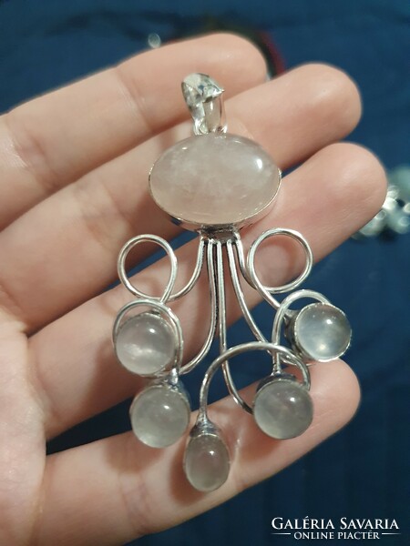 A wonderful rose quartz pendant set in silver, in a unique style