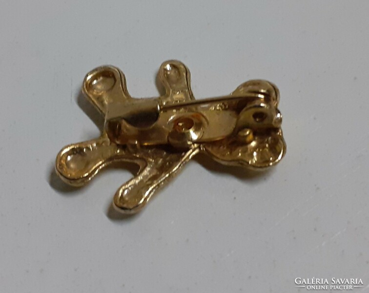 Gold-plated teddy bear brooch in good condition, studded with small stones