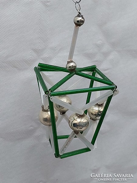 Old glass geometric Christmas tree decoration with green lantern glass ornament