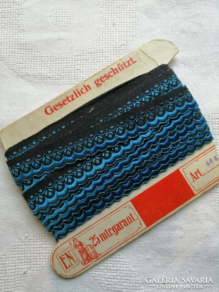Antique woven ribbon in original packaging, blue-black