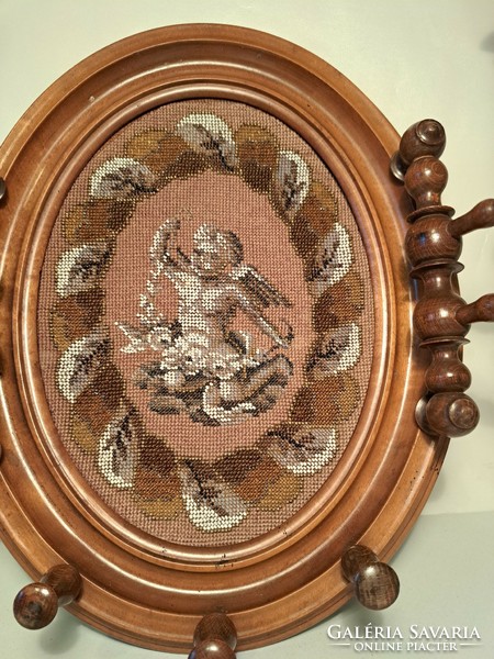 Wall picture embroidered with pearls in a carved wooden frame