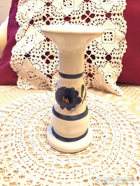 Glazed ceramic candle holder with a hand-painted blue pattern