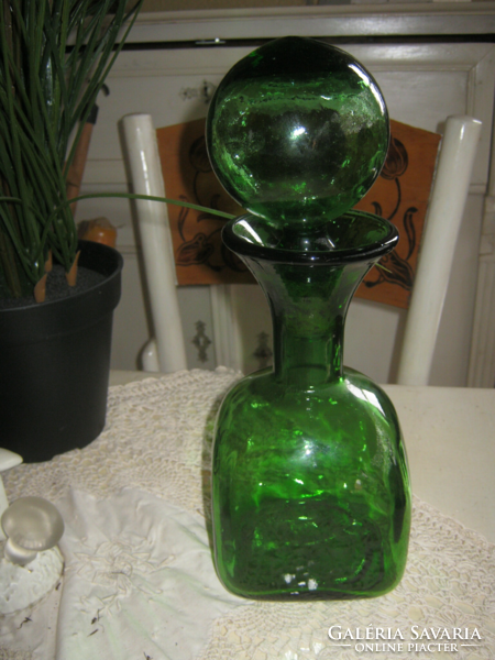 Giant spherical vintage 1 l green bottle with cork