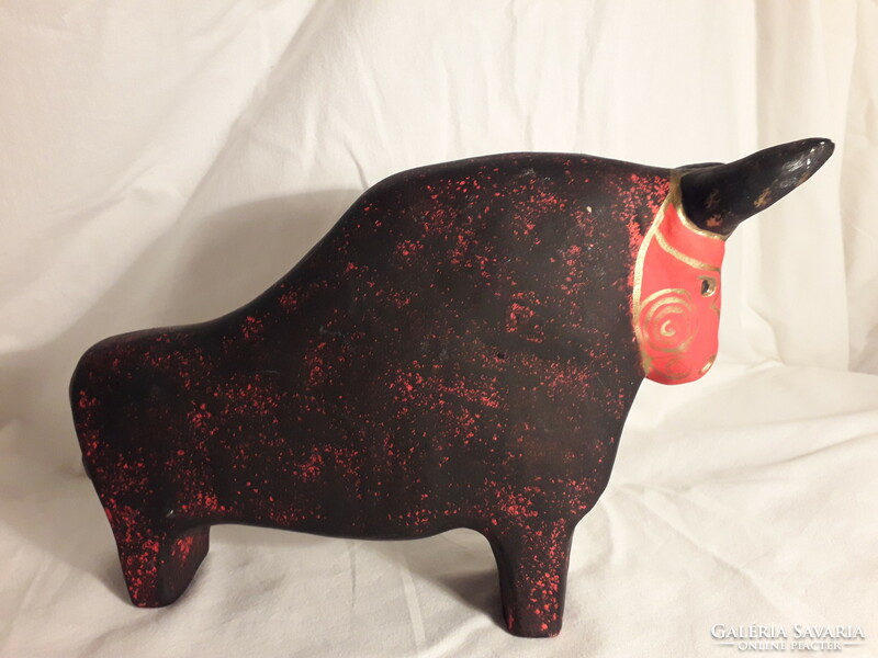Rot ceramic ceramic bull with a marked paper label, slightly damaged