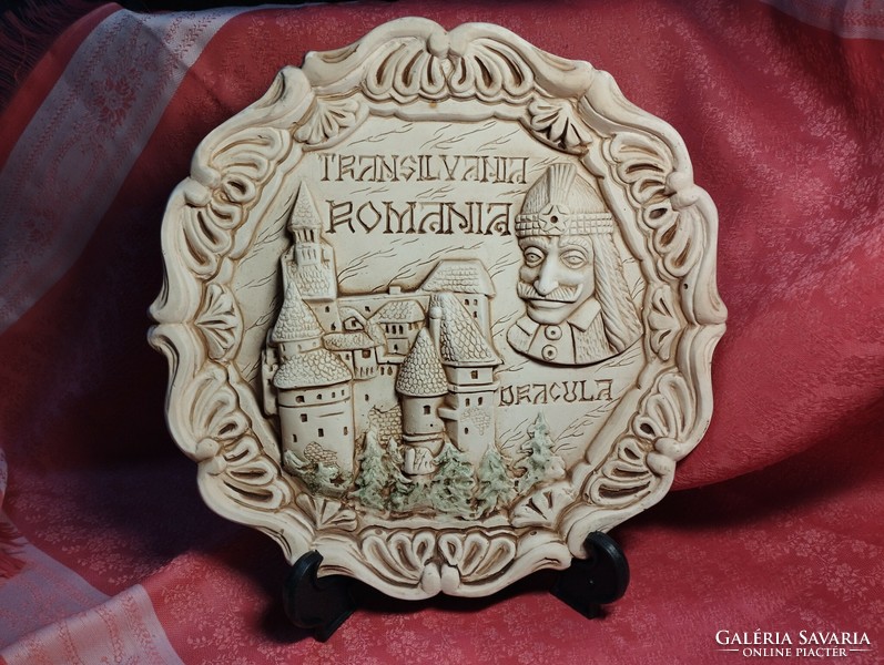 Dracula and his castle on a ceramic plate with a relief pattern