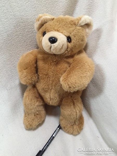 Teddy bear with medium brown, silky fur, opening pocket at the back