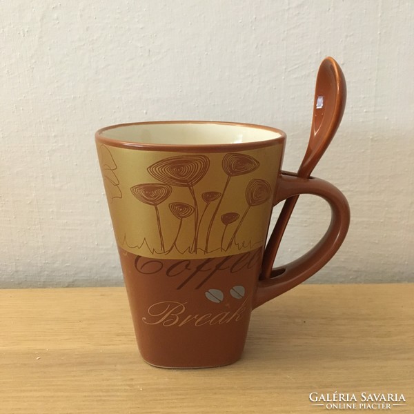 Brown coffee mug with spoon